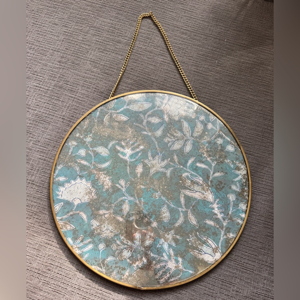 Pretty blue and gold Anthropologie wall decor.